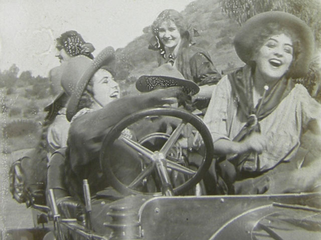 Ruth Roland takes the wheel in Walk–You Walk! (1912)